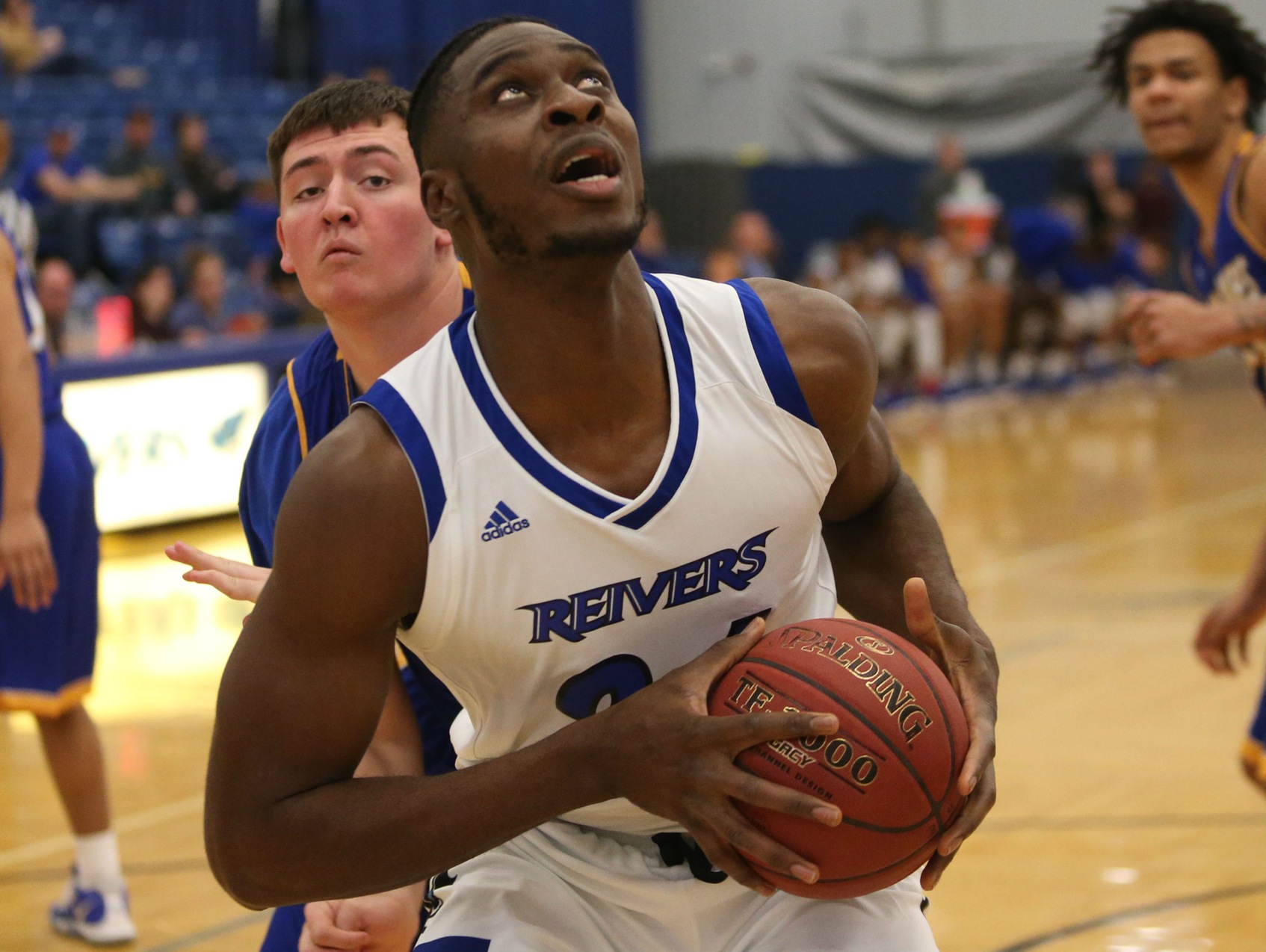 Emmanuel Ugboh was one of 13 Reivers on the men's basketball team to be honored at half-time for their Academic All-Region performances this year.