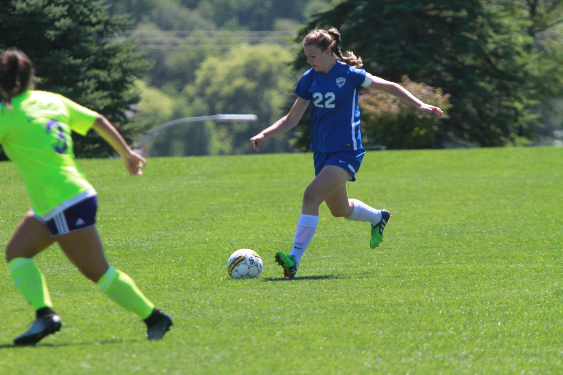 Sophomore defender, Kate Reddish, looks to connect a pass with a midfielder.