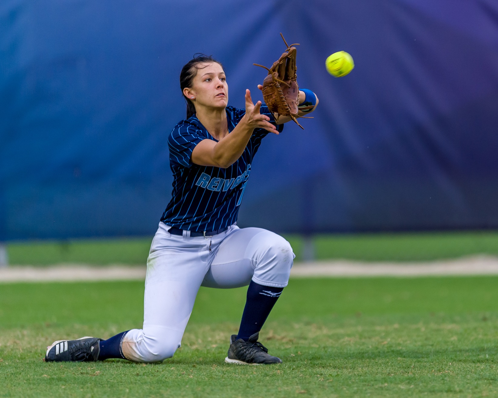 Sophomore Centerfielder Lily Gregory prepares to record an out.

PHOTO COURTESY OF CAPTIVE PHOTONS captivephotons.com