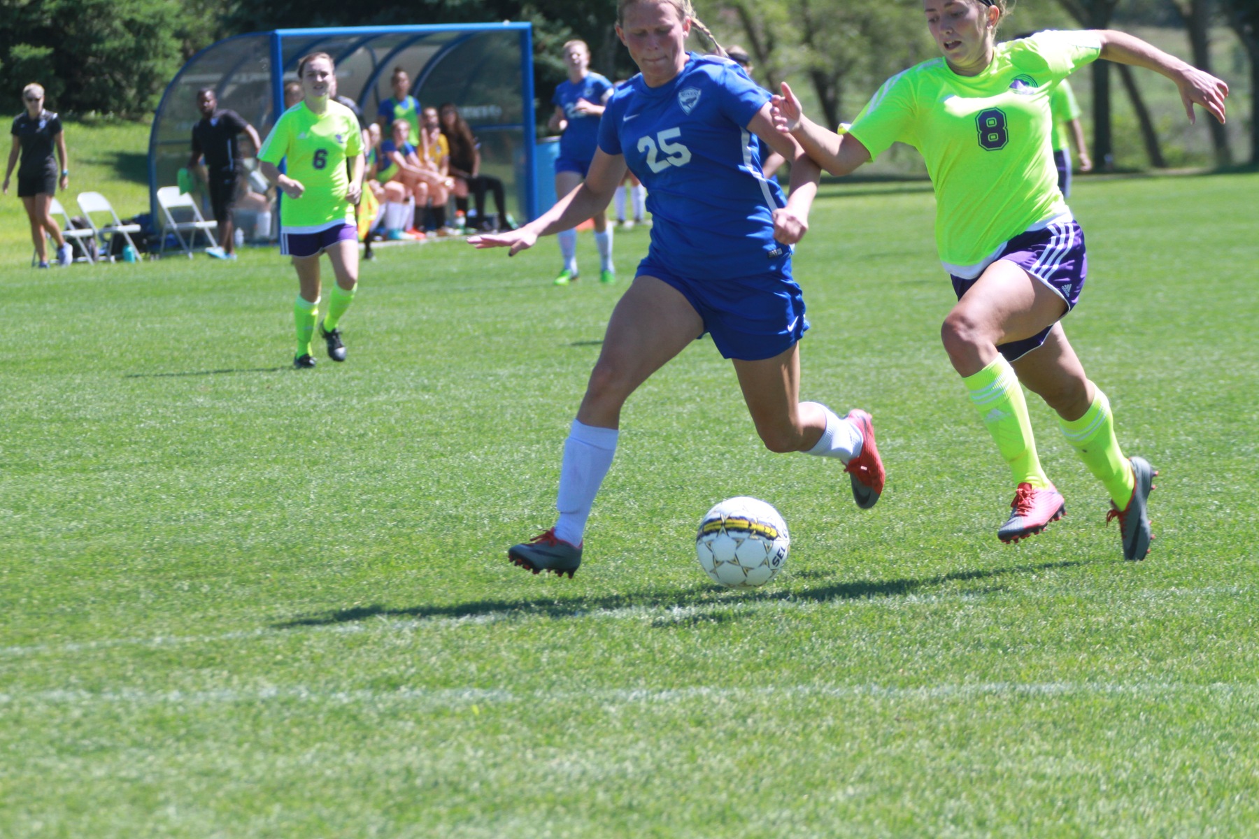 Freshman Forward Ashley Overberg fights to win a ball in the attacking third.